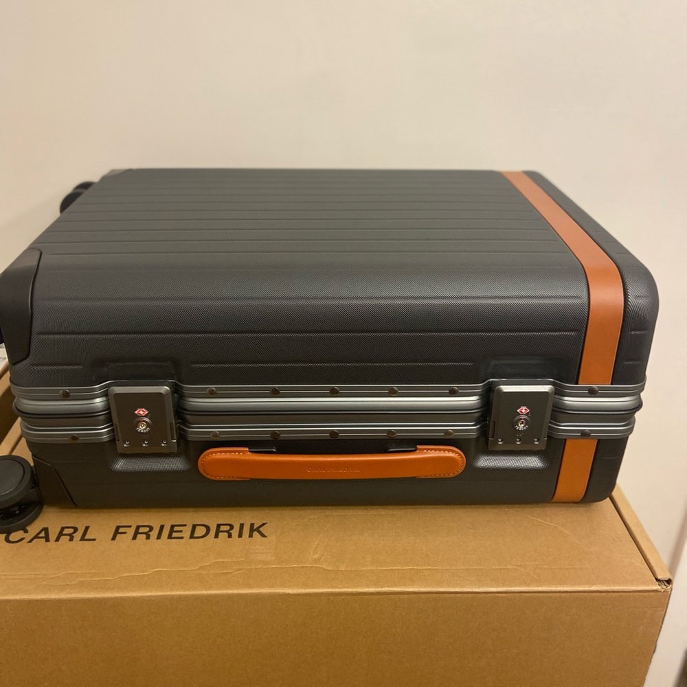 Carl Friedrik Carry-On Suitcase. Cognac leather color. As seen in Succession.